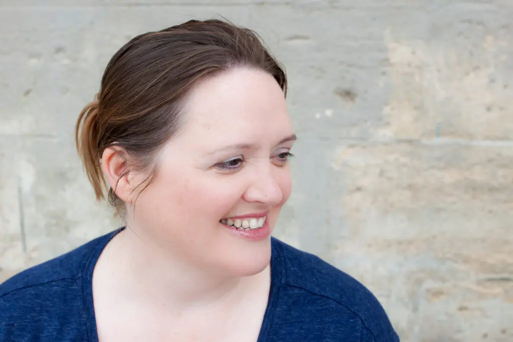 Debby, Peaches Trustee and supporters, white female, brown hair tied back, blue top