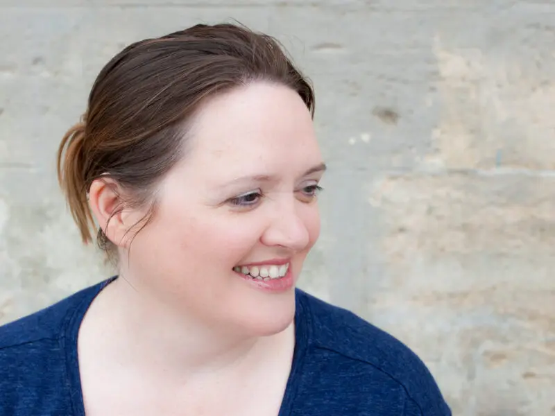 Debby, Peaches Trustee and supporters, white female, brown hair tied back, blue top